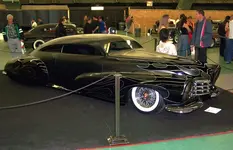 Barry_Weiss_cowboy_Cadillac.webp
